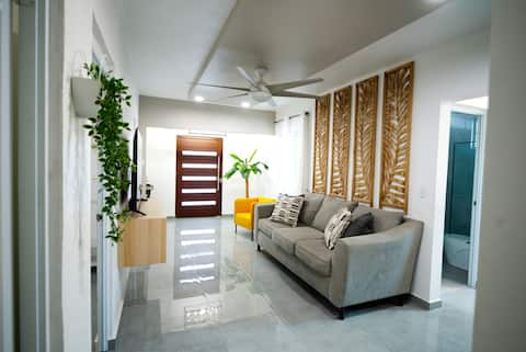 Sunlit entryway with carved wood panels