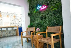 Lounge seating beside a vertical garden