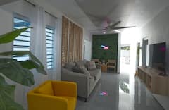 Bright living room with yellow accent chair