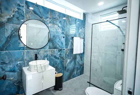 Blue marble bathroom with rainfall shower